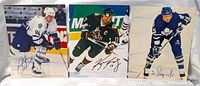 Three signed NHL 8x10 photos laid out side by side showing all players and signatures