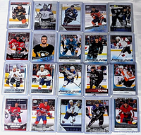 Top view of 20 Upper Deck NHL rookie hockey cards arranged in 4 rows and 5 columns, showing various NHL players in action.