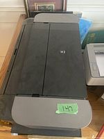 Closed top view of Canon PIXMA PRO-100 printer showing the smooth top panel and front output tray.