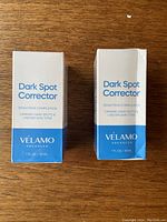 Front view of two sealed Velamo Dark Spot Corrector Serum boxes showing branding and volume