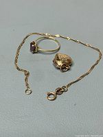 All three pieces displayed together on gray surface