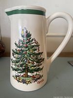 Porcelain jug front showing Spode Christmas Tree design with presents and ornaments