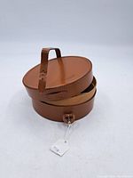 Round vintage leather collar box with handle top and open lid