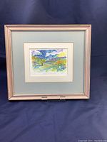 Framed signed landscape mono print with visible colors and signature.