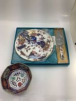 Coalport serving plate in box with pie lifter and Imari style bowl beside it