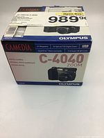 Front view of Olympus Camedia C-4040 Zoom camera box showing branding, model and features.