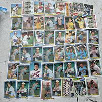 Photo showing a collection of 38 baseball cards laid out in rows on a surface, including multiple Minnesota Twins players, Cincinnati Reds, and others.