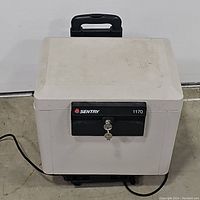 Front view of the Sentry Safe 1170 showing the key lock and handle on top