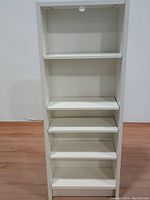 Front view showing five shelves and overall height.