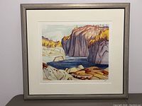 Full view of framed and matted print showing autumn river scene