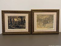 Two framed reproduction David Milne prints displayed side by side on a surface, showing the texture of the fabric matting and ornate wood frames.
