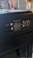 Close-up of Chambrer electronic wine cooler digital control panel showing preset and temperature adjustment buttons.
