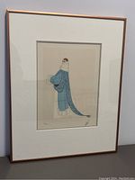 Full view of framed lithograph showing matted Art Deco fashion illustration
