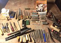 Overview of all tools laid out, including chisels, files, rasps, planes, stones and sharpening accessories