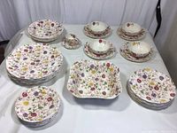 Full set laid out on table showing all included pieces with vibrant floral pattern.