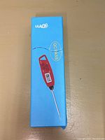 Blue retail box of EAAG digital kitchen thermometer showing product illustration and logo.