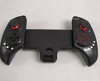 Full frontal photo of iPega mobile game controller with phone holder showing left and right controllers and center holder.