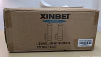 Closed cardboard box bearing the Xinbei Lighting branding and model number XB-W1185-2BN26, with an illustration of the paired light fixtures.