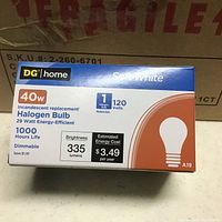Box of DG Home soft white 40 watt halogen bulb showing front of packaging with bulb shape and wattage details.