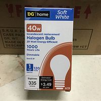 Image of a DG Home Soft White 40W Halogen Bulb box showing front packaging details including wattage, lumens, estimated energy cost, and features.