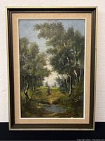 Full view of framed oil painting depicting landscape with trees, pond, and two walking figures.