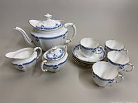 Complete set: teapot, sugar bowl, creamer, four cups and four saucers