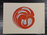 Clear top-down photo of the First Nations art print showing full artwork with circular red and grey-blue design on cream paper.