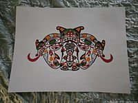 Photo shows a single unsigned print titled 'Longhouse Mask' by John Nelson. Print measures approximately 19 by 25 inches, featuring colorful indigenous-style mask graphic.