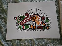 Photo of unsigned print titled Otter with Sea Urchin by John Nelson, showing stylized otter and sea urchin in black, green, red, and orange on white background.