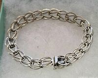 Photo of the full bracelet laid out showing linked chain design and clasp.