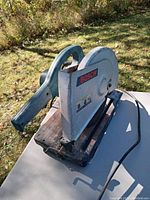 Side view of Bosch 3814 14-inch abrasive cut off saw showing the handle, blade guard, and Bosch branding.