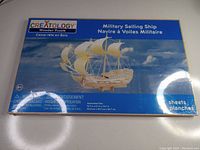 Box front showing the Creatology brand and image of the assembled wooden military sailing ship puzzle, 5 sheets included.