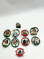 Lot of 10 Norman Rockwell Christmas ornaments arranged on a white background