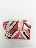 Front view of Puccini women's wallet showing geometric pattern and gold logo plaque