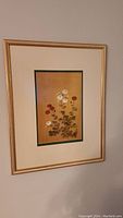 Full view of one framed botanical painting on silk with flowers and signature