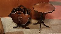 Photo showing pie crust edge side table and wooden magazine rack together