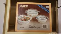 Original box front showing Pyrex Corning 3 Piece Set with floral pattern on dishes
