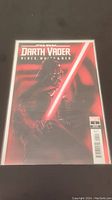Front cover of the comic showing Darth Vader holding a red lightsaber in a high contrast black, white, and red color palette. The issue number, Marvel logo, and barcode are visible on the bottom right corner.