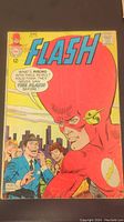 Front cover of The Flash comic book number 177, showing the large head of The Flash character and city background, with speech bubble text and a price of 12 cents.