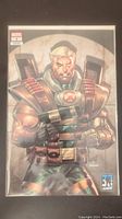 Full front view of X-Force Killshot #1 variant edition comic in bag and board showing full cover art with Cable character.