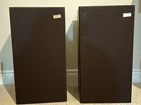 Pair of Sony SS 955 floor speakers side by side, front view showing brown fabric grille and Sony logos