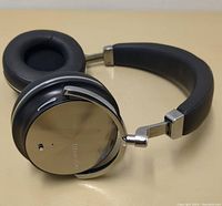 Side view of the reflective silver ear cup and cushioned ear pad of Bluedio Turbine headphones.