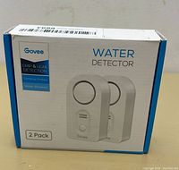 Front view of the product box showing the Govee Water Detector 2 pack packaging with drip and leak detection, sensitive probes, water-resistant features.
