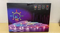 Closed product box displaying colorful LED strip lights and feature icons