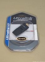 Front view of sealed Ultralink HDMI-180 adapter in blister packaging, showing branding and product name.