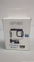 Front view of the sealed Optex waterproof housing case box showing branding, product image, and 50 meters waterproof rating.