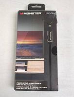 Front of the Monster fiber optic audio cable packaging showing the brand, length of 10ft (3m), and an image of a TV setup implying use for soundbars and home theater audio.
