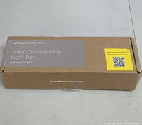 Box labeled 'HumanCentric Video Conferencing Light Bar Expansion Pack' on white surface.