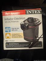 Photo of Intex electric air pump box showing front side with model details in Spanish.