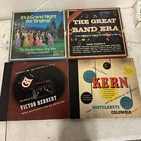 Four vintage vinyl record covers arranged on a table, showing all four albums in the set.